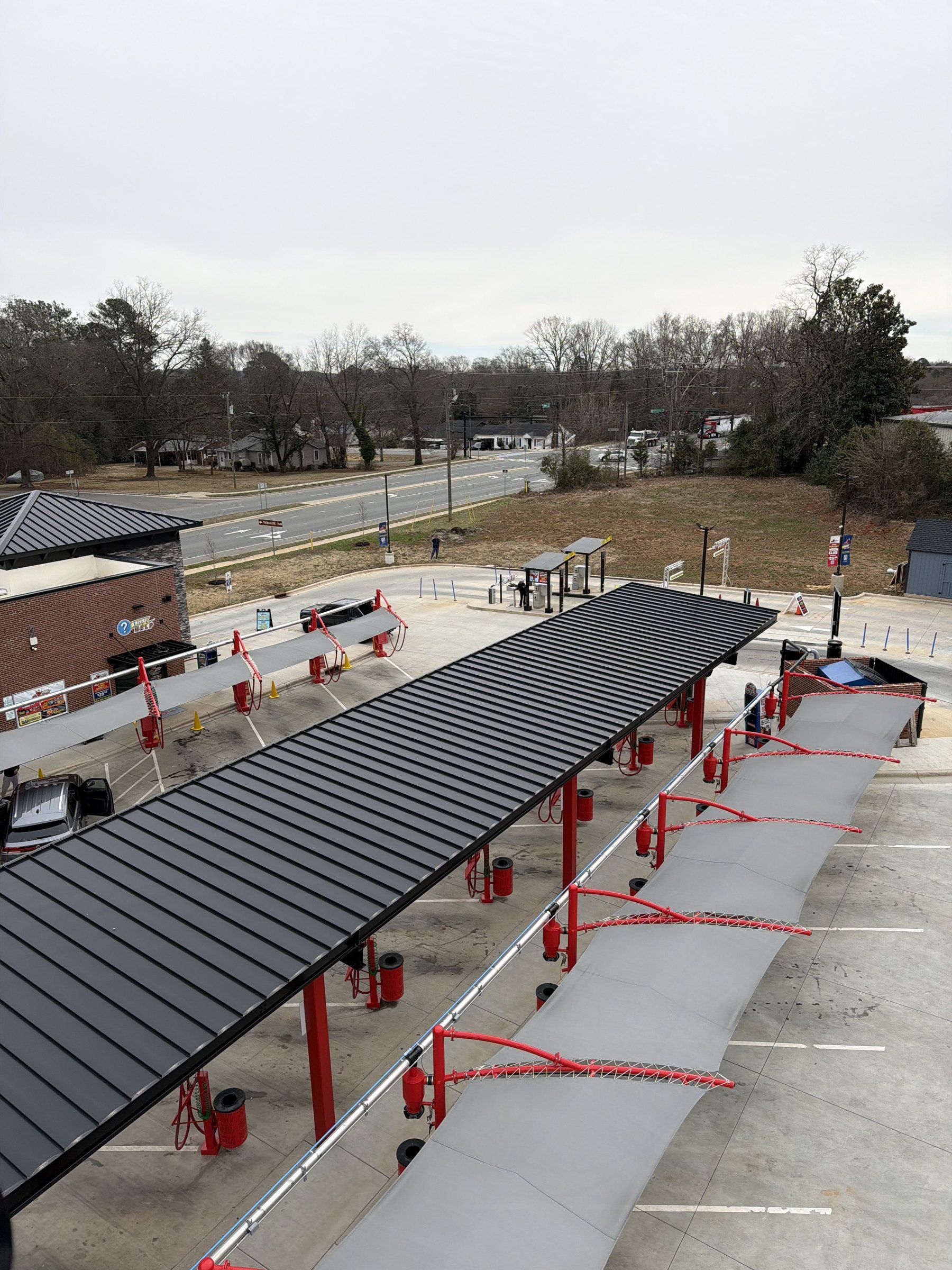 The vacuum canopy on the Tiger Xpress lot, lined with red vacuum arches