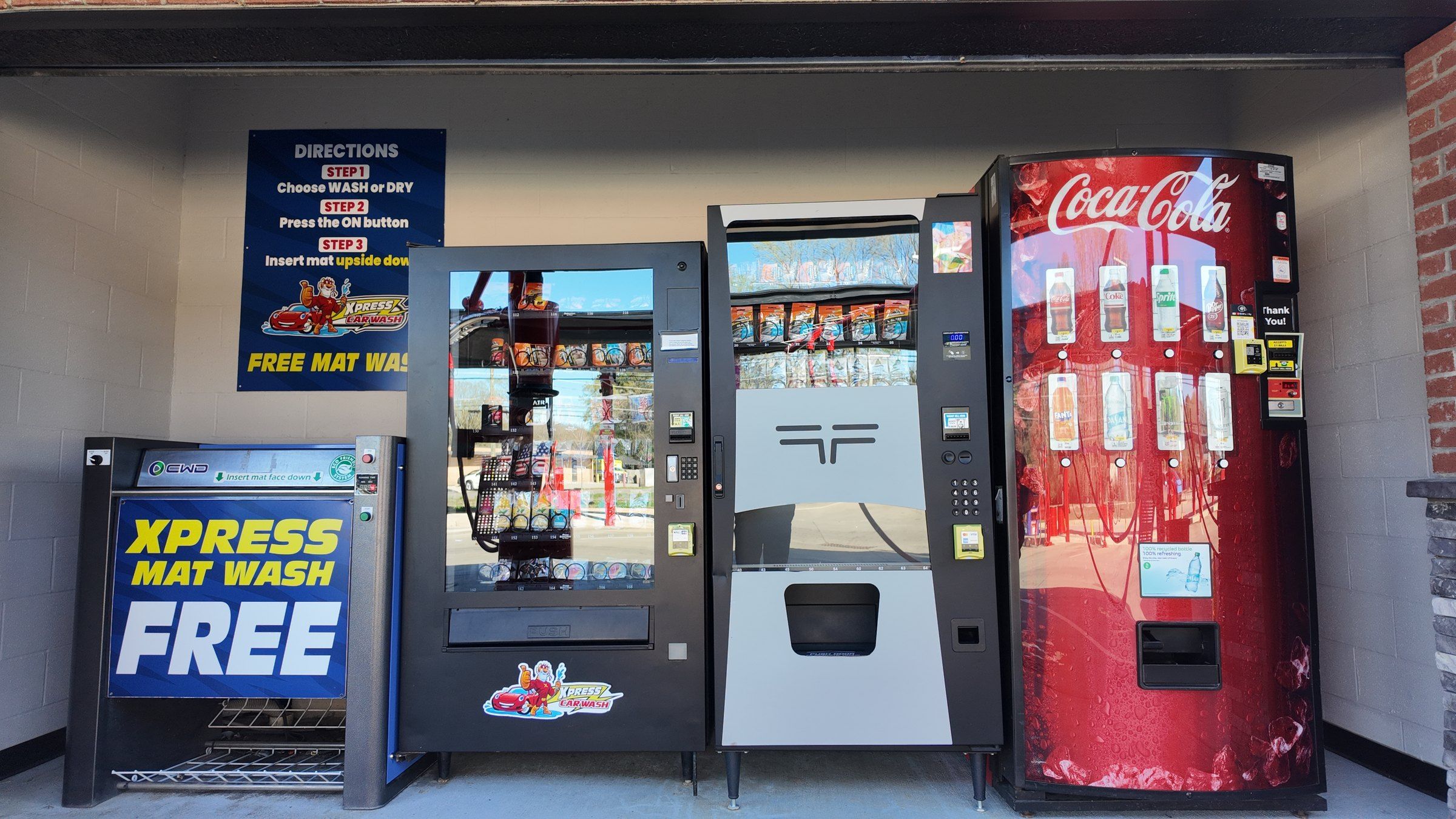 The Tiger Xpress vending wall: detailing supplies, a drinks machine and the Xpress Mat Wash
